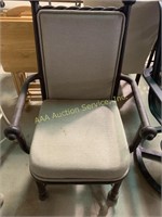 Brown metal chair with upholstered cushion,