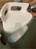 White plastic shower corner seat, 19 inches wide