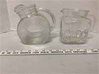2 clear glass pitchers