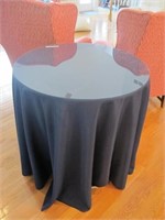 DISPLAY TABLE WITH BLUE TABLE CLOTH AND GLASS TOP