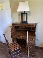 Small roll top desk with chair and lamp