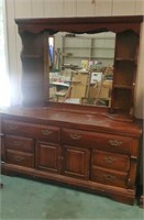 Nice brown wood dresser with mirror approx size