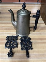 Antique coffee pot, and two cast-iron trivets
