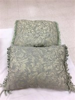 2 green pillows with fringe