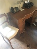 Small office desk with chair and contents