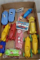 Box of race cars & boat incl original packaging