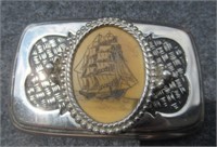 Scrimshaw belt buckle.