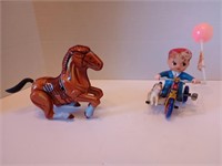 2 1960s working tin litho toys. Horse rears up!