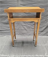 Vintage 1960's walnut bookstand on casters,