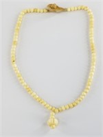 Ivory bead antique necklace about 14" long,