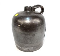 Dark brown stoneware jug, approximately 1 gallon