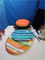 Stack of colorful plastic plastic platters and