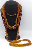 A collection of amber style necklaces