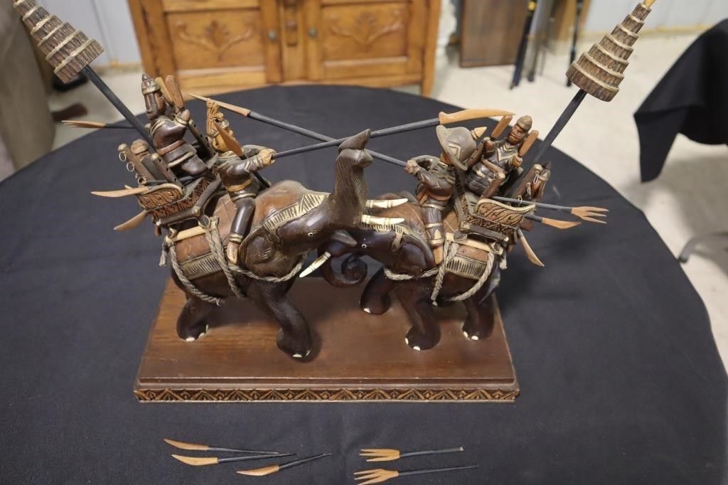 Thai wood carving of battle elephants and