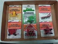 assortment of 1/64 scale implements