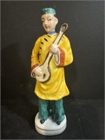 Asian Figure with Musical Instrument