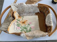 vintage basket with doilies and fabric items