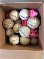 box of softballs and volleyball net