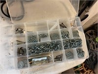 Container filled with screws
