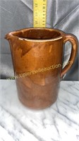 Brown glazed pottery pitcher