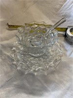 Small glass bowl with plate and laddle