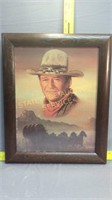 Portrait of John Wayne in thick wooden frame