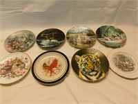 8 decorative plates, 4 cats, 3 birds, & 1 house.