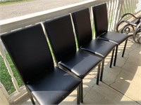 Set of four black chairs
