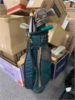 Golf clubs with green bag
