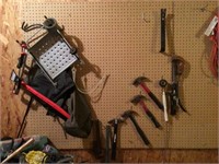 items on wall hammers, tools etc.