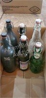 6 beer bottles with lids and bales