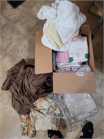 BOX OF BEDDING AND TABLE CLOTHS