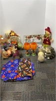 Box of fall decorations including scarecrows,