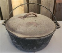 Antique cast iron camping pot with handle