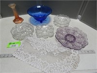 Assorted serving dishes; candle holder; table runn