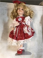 Collectible doll on doll stand