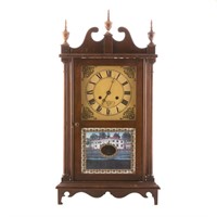 Scroll steeple clock in wood case