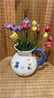 Tulips in a pitcher vase