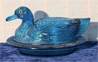 Blue glass covered duck