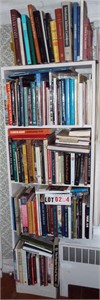 5 shelves books:  folk art, paintings,