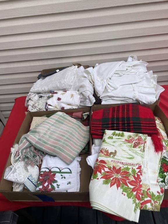 Large amount of tablecloth, towels, and linens