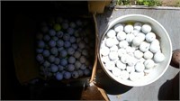 bucket and box of golf balls