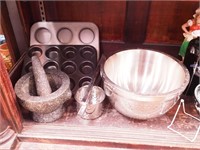 Kitchen items including muffin pans;