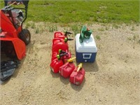 7 gas cans, cooler and grass seeder