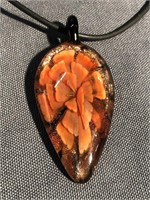 Glass pendant with rose petals on the inside