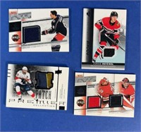 4-mixed NHL jersey cards.
