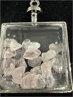 1 in.Square glass jar filled with pieces of rose