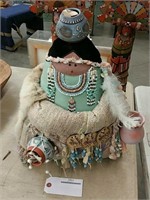 Native doll with pots one on head