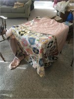 worn vintage hand stitched quilt