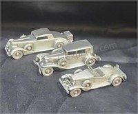 Pewter automobiles from The Danbury Mint.